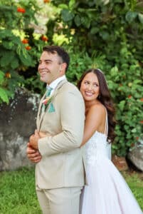 bride and groom hugging and smiling