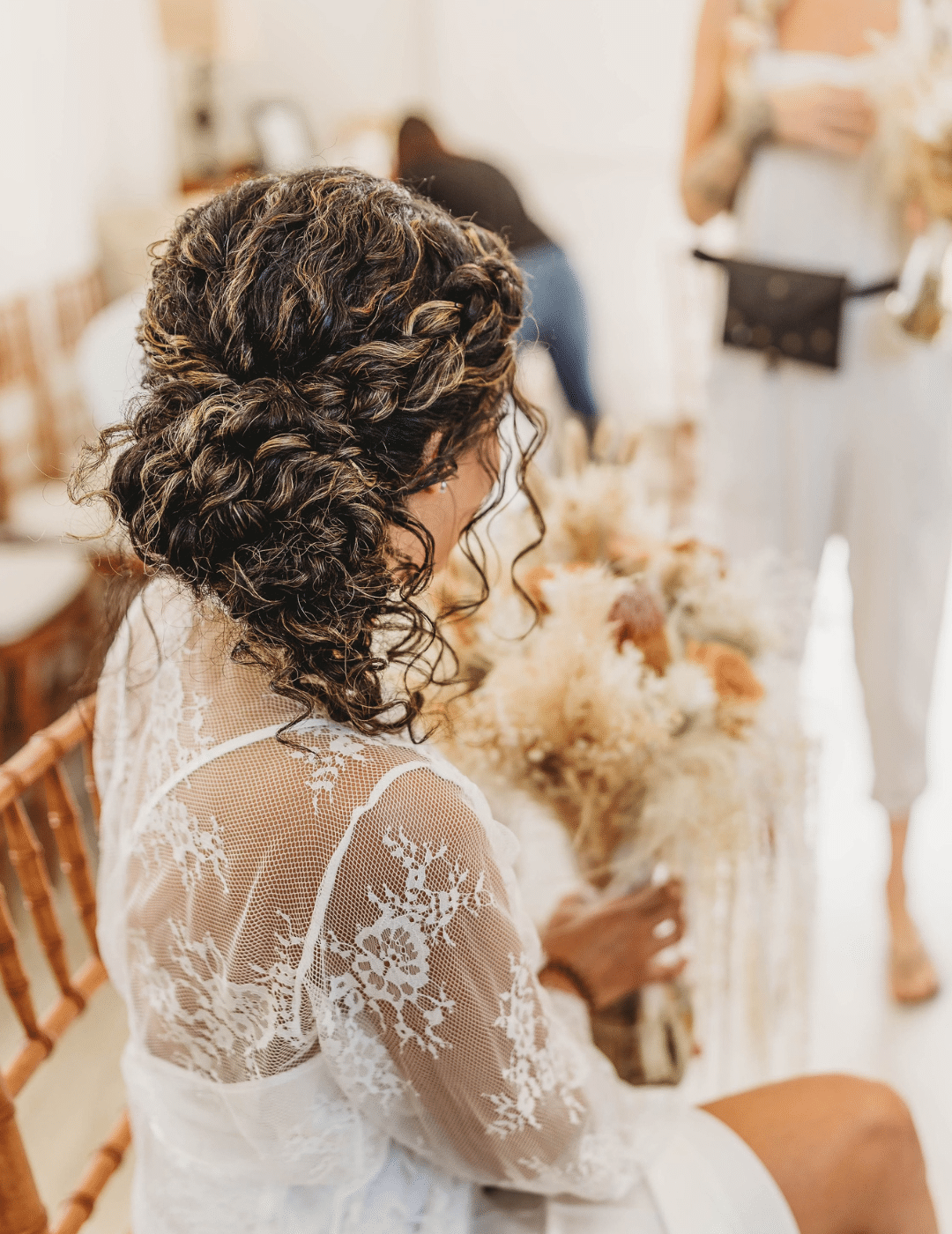 naturally curly hair up do on bride